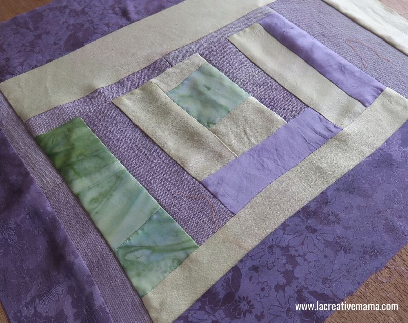 making a simple quilt using fabric scraps and the log cabin quilting block