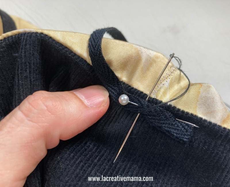 sewing the strap to the purse