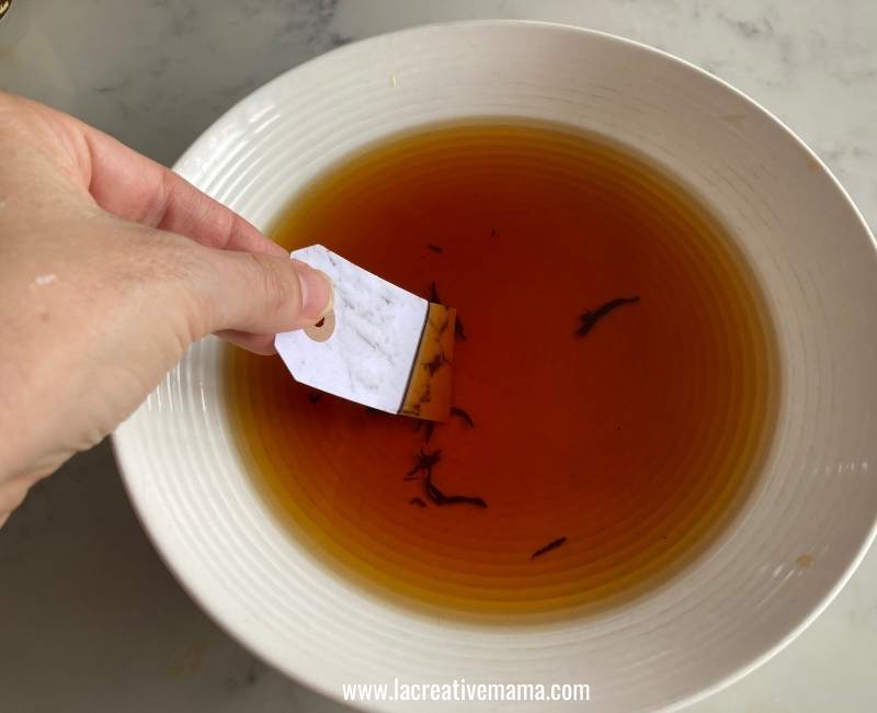 tea dyeing a paper gift tag 