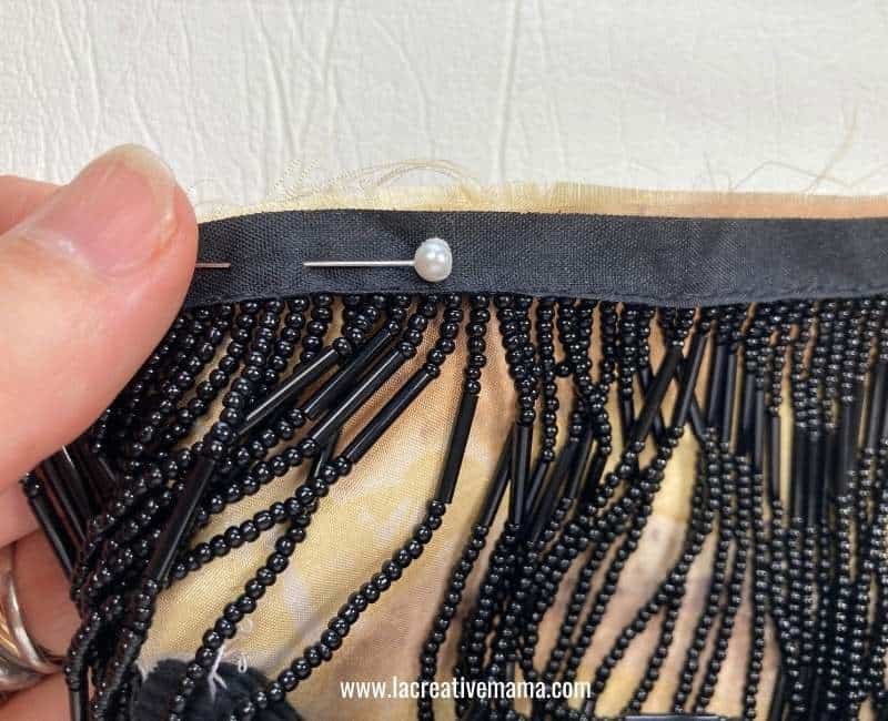 pinning the beaded fringe to the bag 