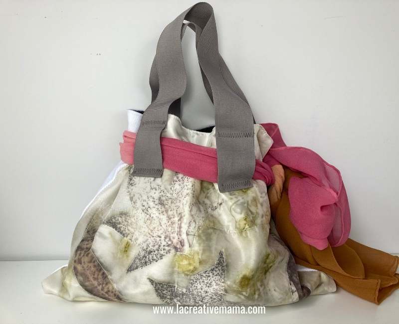 another version of the finished drawstring bag using eco printed fabric and a multicolor dyed silk scarf