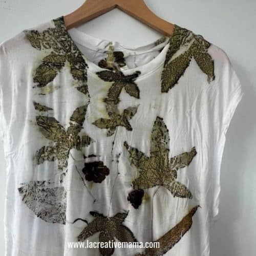 an eco printed t-shirt using dried leaves and flowers