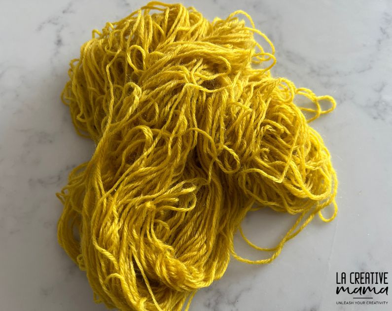 the finished result after dyeing wool yarn using goldenrod flowers 