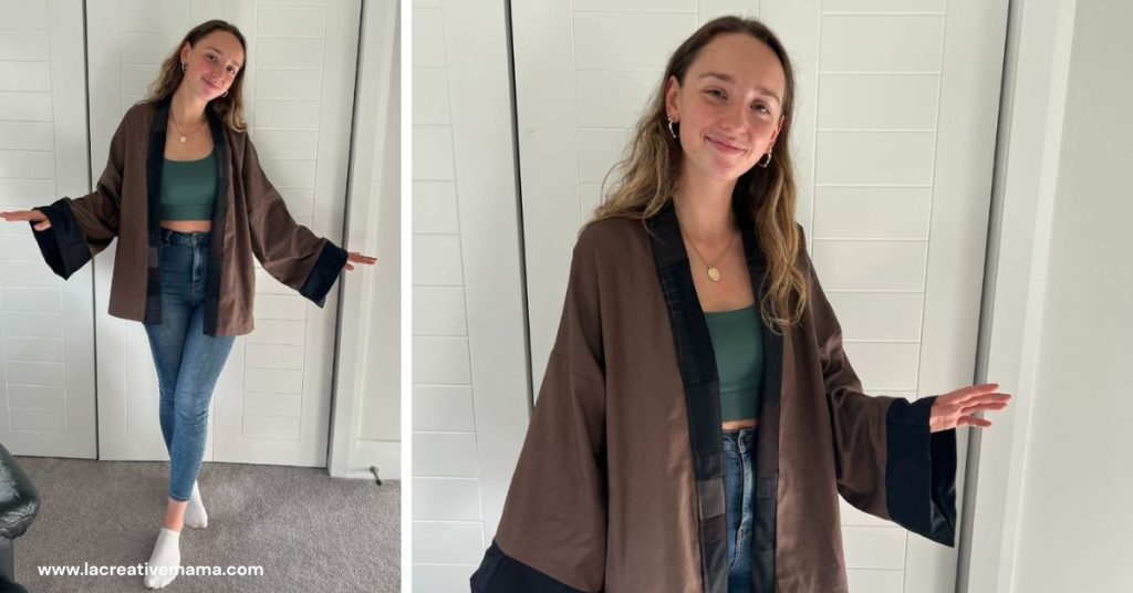 a student wearing a brown color cotton kimono inspired top with black neckband detail. 